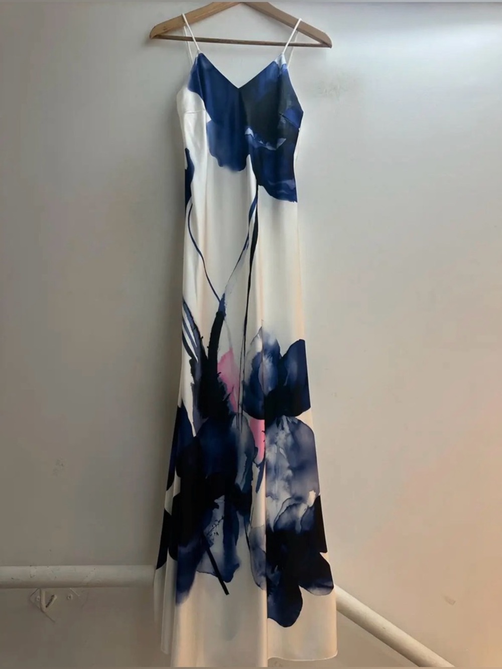 Elegant White Spaghetti-Strap Maxi Dress with Blue Floral Print